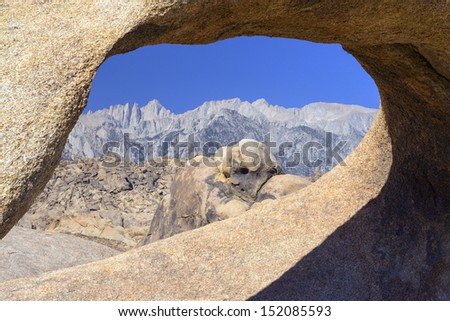 Mt Whitney through Arch Rock called Mobius Arch in Alabama Hills, California.