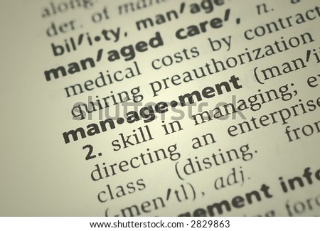 the word management from the dictionary showing a shallow depth of field