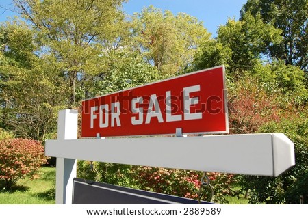 Real estate sign on land for sale