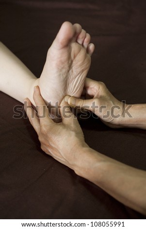 reflexology foot massage, spa foot treatment.
