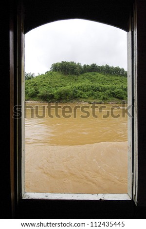 Asian river through boat window