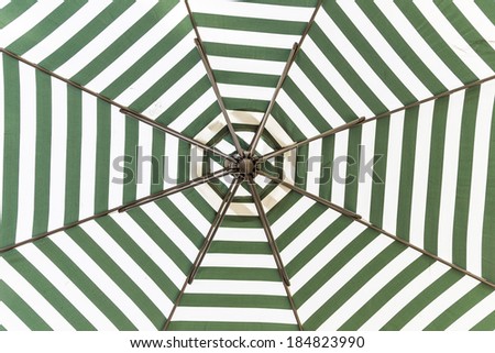 Green and white umbrella beach