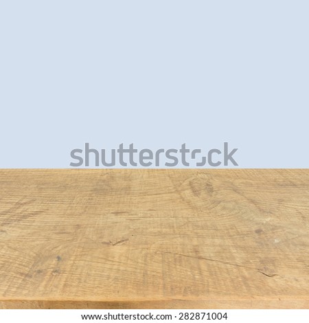 Brown wood plank texture background with blue wall for product show use.