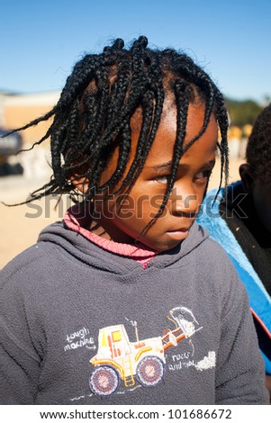 MALOLOTJA, SWAZILAND-JULY 31: Unidentified orphan schoolboy on July 31, 2008 in Malolotja Government School, Malolotja, Swaziland. Close to 10% of SwazilandÃ¢Â?Â?s population are orphans, due to HIV/AIDS.