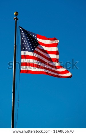 The Stars and Stripes (US national flag) set against a blue sky