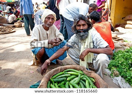 VARANASI - APRIL 23: Market vendors selling vegetables on a market on April 23, 2011 in Varanasi, India. India ranks second worldwide in farm output. Agriculture employs 52.1% of the total workforce