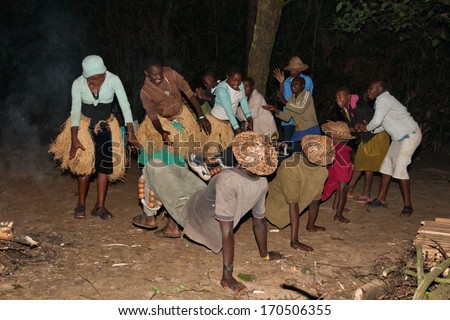 LAKE BUNYONYI, UGANDA - OCTOBER 22: Batwa pygmies dancing on October 22, 2012 at Lake Bunyonyi, Uganda. Pygmy people are ancient dwellers in the forests, they were known as The Keepers of the Forest.