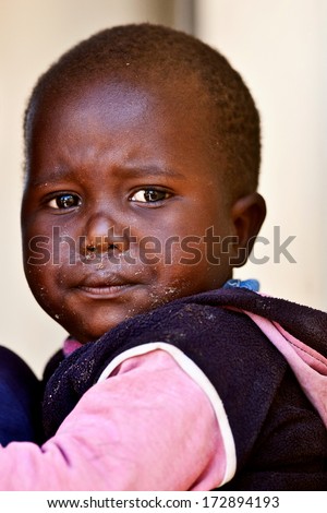 MBABANE, SWAZILAND - AUGUST 5: Portrait of unidentified orphan Swazi boy on August 5, 2008 in Mbabane, Swaziland. Close to 10 percent of Swaziland\'s total population are orphans, due to HIV/AIDS.