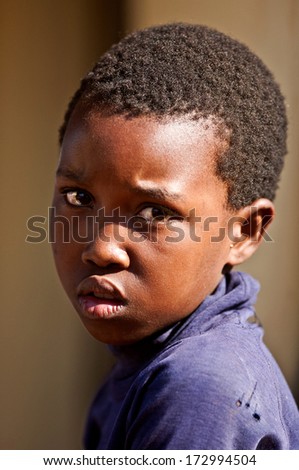 MBABANE, SWAZILAND - AUGUST 5: Portrait of an unidentified orphan Swazi girl on August 5, 2008 in Mbabane, Swaziland. Close to 10 percent of Swaziland\'s total population are orphans, due to HIV/AIDS.