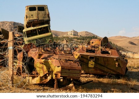 HERAT, AFGHANISTAN - OCT 25: Abandoned trucks and armored tanks on October 25, 2012 in Herat, Afghanistan. Herat is the third largest city of Afghanistan, with a population of about 450,000.