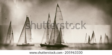 Vintage style black and white image of a sailing regatta on the sea