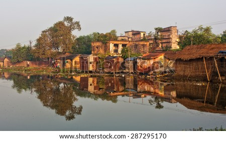 RAXAUL, INDIA - NOV 7: Houses of a poor Indian town on Nov 7, 2013 in Raxaul, Bihar state, India. Bihar is one of the poorest states in India. The per capita income is about 300 dollars.