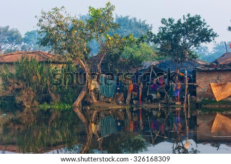 RAXAUL - NOV 7: Houses of a poor Indian town on Nov 7, 2013 in Raxaul, Bihar state, India. Bihar is one of the poorest states in India. The per capita income is about 300 dollars.