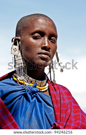 SERENGETI, TANZANIA-MARCH 16: Portrait of unidentified Maasai woman on March 16, 2010 in Serengeti, Tanzania. Maasai are a Nilotic ethnic group of semi-nomadic people located in Kenya and Tanzania.