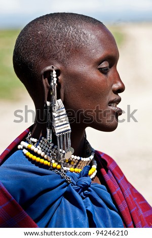 SERENGETI, TANZANIA-MARCH 16: Portrait of unidentified Maasai woman on March 16, 2010 in Serengeti, Tanzania. Maasai are a Nilotic ethnic group of semi-nomadic people located in Kenya and Tanzania.
