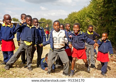 PIGGS PEAK, SWAZILAND-JULY 29: Unidentified Swazi pupils on July 29, 2008 in Nazarene Mission School, Piggs Peak, Swaziland. Close to 10% of Swaziland’s population are orphans, due to HIV/AIDS.