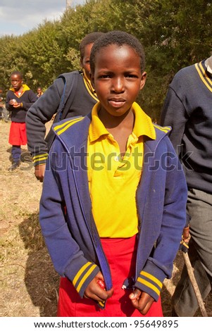 PIGGS PEAK, SWAZILAND-JULY 29: Unidentified Swazi schoolgirl on July 29, 2008 in Nazarene Mission School, Piggs Peak, Swaziland. Close to 10% of Swaziland population are orphans, due to HIV/AIDS.