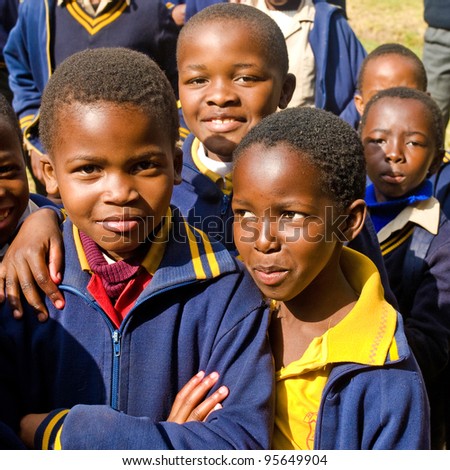 PIGGS PEAK, SWAZILAND-JULY 29: Unidentified Swazi pupils on July 29, 2008 in Nazarene Mission School, Piggs Peak, Swaziland. Close to 10% of Swaziland population are orphans, due to HIV/AIDS.