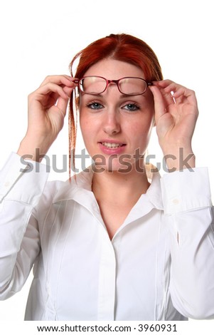 Young woman lifting her glasses