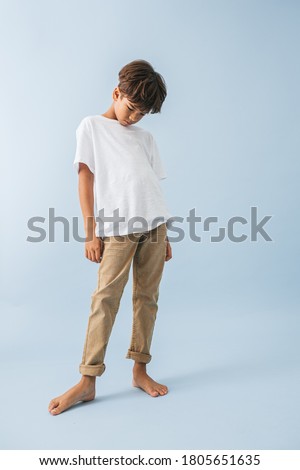 Similar – Image, Stock Photo Sad boy looking down in studio