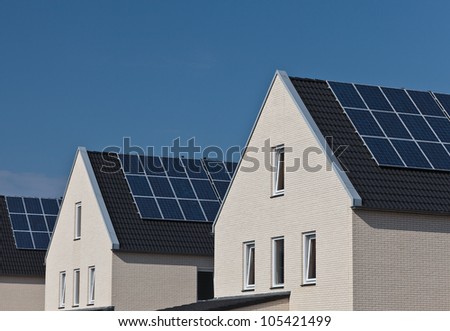 Newly build family homes with solar panels attached to the roof
