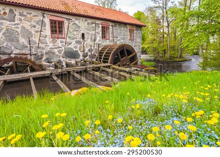 HUSEBY BRUK, SWEDEN - MAY 20, 2015: Ancient restored water mill in Huseby Bruk in the province of Smaland, Sweden