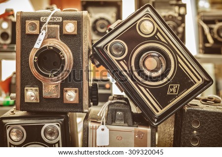 DOESBURG, THE NETHERLANDS - AUGUST 23, 2015: Sepia toned image of old box cameras on a flee market in Doesburg, The Netherlands