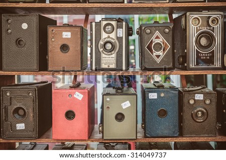 DOESBURG, THE NETHERLANDS - AUGUST 23, 2015: Sepia toned image of old box cameras on a flee market in Doesburg, The Netherlands