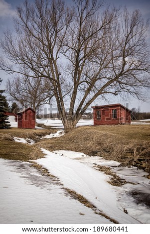 Snow Fades in the Country - A brooder and small shed are a welcome sight in this Spring view of a country setting in Rotterdam, New York.