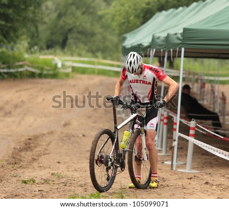 MOSCOW, RUSSIA - JUNE 7: Austrian biker in technical zone during European Mountain Bike Cross-country Championship in Moscow, Russia at June 7, 2012.