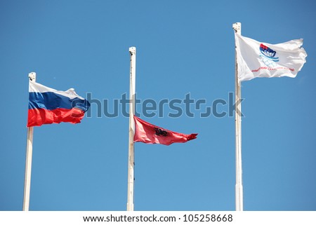 MOSCOW, RUSSIA - JUNE 9: Flags of Russia, Moscow city, and Olympic Rowing Stadium waves during 51th International Grand Moscow Regatta in Moscow, Russia on June 9, 2012