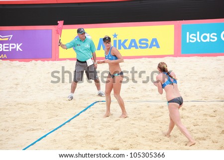 MOSCOW, RUSSIA - JUNE 8: K. Kolocova (right) and M. Slukova (center), Czech Republic vs E. Ukolova - E. Khomyakova, Russia, during Beach Volleyball Swatch World Tour in Moscow, Russia at June 8, 2012