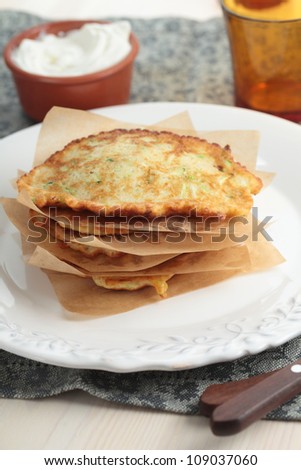 Stack of zucchini pancakes on a plate