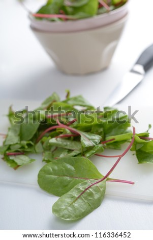 Leaves of red chard on a cutting board