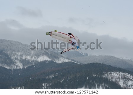 BUKOVEL, UKRAINE - FEBRUARY 23: Jean-Christophe Andre, Canada performs aerial skiing during Freestyle Ski World Cup in Bukovel, Ukraine on February 23, 2013.