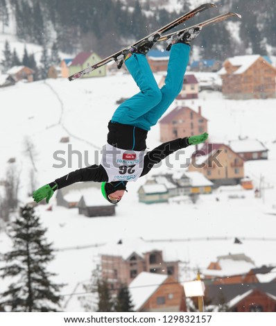 BUKOVEL, UKRAINE - FEBRUARY 23: Lloyd Wallace, Great Britain performs aerial skiing during Freestyle Ski World Cup in Bukovel, Ukraine on February 23, 2013.
