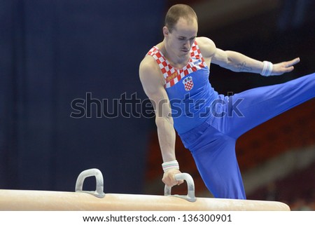 MOSCOW, RUSSIA - APRIL 20: Filip Ude, Croatia performs exercise on pommel horse in final of 5th European Championships in Artistic Gymnastics in Moscow, Russia on April 20, 2013