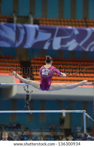 MOSCOW, RUSSIA - APRIL 20: Aliya Mustafina, Russia performs exercise on uneven bars in final of 5th European Championships in Artistic Gymnastics in Moscow, Russia on April 20, 2013