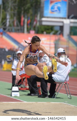 DONETSK, UKRAINE - JULY 13: Florentina Marincu, Romania, fight for her gold medal in long jump during World Youth Championships in Donetsk, Ukraine on July 13, 2013