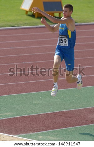DONETSK, UKRAINE - JULY 12: Pavlo Beznis of Ukraine competes in the triple jump during 8th IAAF World Youth Championships in Donetsk, Ukraine on July 12, 2013