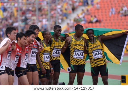 DONETSK, UKRAINE - JULY 14: World Youth Champions in the medley relay team Jamaica and bronze medalist team Japan during 8th IAAF World Youth Championships in Donetsk, Ukraine on July 14, 2013