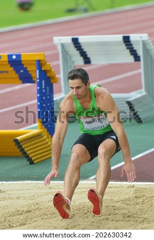 ZHUKOVSKY, MOSCOW REGION, RUSSIA - JUNE 27, 2014: Evgen Semenenko of Ukraine performs triple jump during Znamensky Memorial. The competitions is one of the European Athletics Outdoor Classic Meetings
