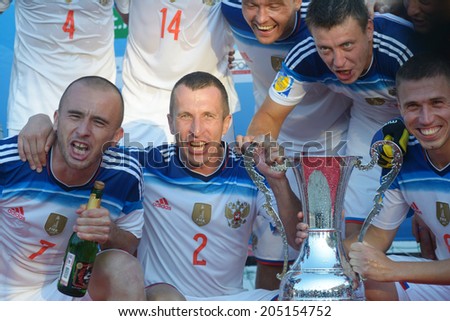 MOSCOW, RUSSIA - JULY 13, 2014: Team Russia with the cup celebrate the victory in Moscow stage of Euro Beach Soccer League. Russia beat Spain 4-1 and took the first place