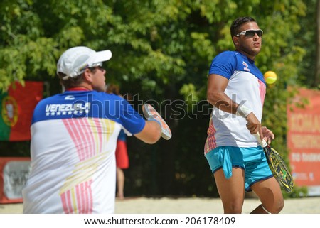 MOSCOW, RUSSIA - JULY 20, 2014: Men double of Venezuela in the match against Spain during ITF Beach Tennis World Team Championship. Spain won the match 2-0