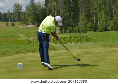 TSELEEVO, MOSCOW REGION, RUSSIA - JULY 24, 2014: John Hahn of USA in action in the Tseleevo Golf & Polo Club during the M2M Russian Open. This golf tournament is the stage of the European Tour