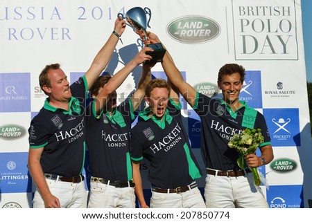 TSELEEVO, MOSCOW REGION, RUSSIA - JULY 26, 2014: Oxbridge Polo Team with prize during the award ceremony of the British Polo Day. Oxbridge beat Tseleevo Polo Club 5-4