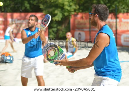MOSCOW, RUSSIA - JULY 19, 2014: Men double of Greece in the match against Thailand during ITF Beach Tennis World Team Championship. Greece won in two sets