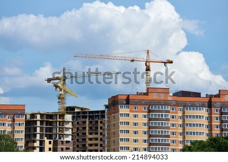 DOLGOPRUDNY, MOSCOW REGION, RUSSIA - JULY 4, 2014: Construction of new residential buildings on the banks of Moscow canal. About 4 millions square meters of housing built in Moscow annually