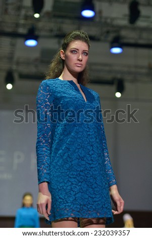NOVOSIBIRSK, RUSSIA - NOVEMBER 15, 2014: Model dressed from Joseph collection on the Grand defile of Novosibirsk Fashion Week. The event was held under the motto High Fashion & High Classics