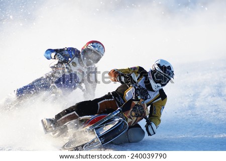 NOVOSIBIRSK, RUSSIA - DECEMBER 20, 2014: Unidentified bikers during the semi-final individual rides of Russian Ice Speedway Championship.